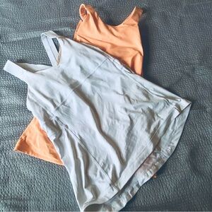 10  LULULEMON SET OF 2  CROSS BACK TOPS ORANGE AND WHITE BUILT IN BRA